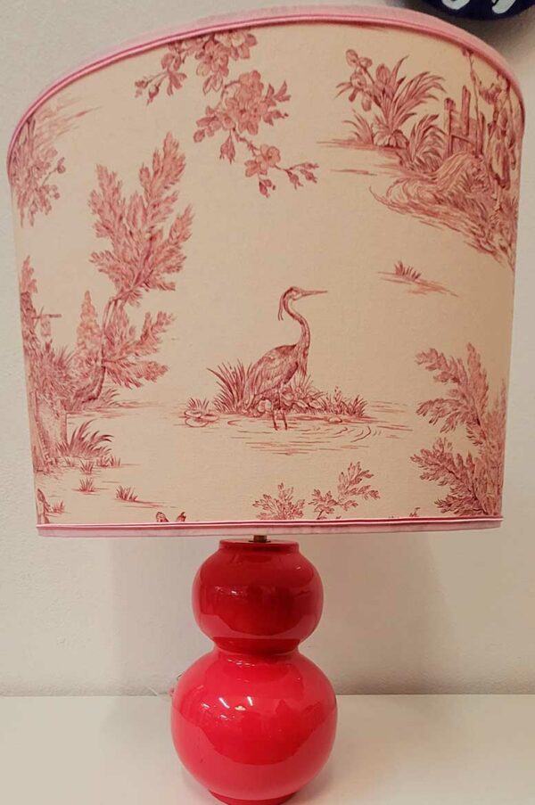 A handmade lampshade with French Toile de Jouy fabric in pink