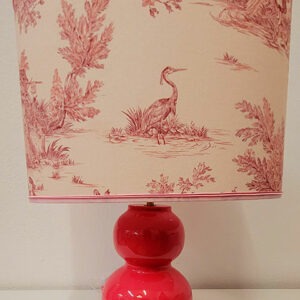 A handmade lampshade with French Toile de Jouy fabric in pink