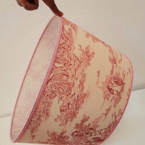 A handmade lampshade with French Toile de Jouy fabric in pink